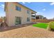 Backyard view highlighting the artificial turf area and desert landscaping at 767 Tallgrass St, Las Vegas, NV 89138