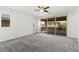Bright bedroom featuring neutral carpet and a sliding glass door to a balcony at 767 Tallgrass St, Las Vegas, NV 89138