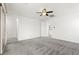Bright bedroom featuring neutral paint, plush carpet, a ceiling fan, and ample natural light at 767 Tallgrass St, Las Vegas, NV 89138