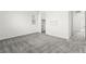 This is a bright bedroom features neutral walls, gray carpet, and a closet at 767 Tallgrass St, Las Vegas, NV 89138