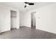 An empty bedroom features tile floors, a walk-in closet, and white walls at 767 Tallgrass St, Las Vegas, NV 89138
