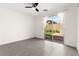 An empty bedroom features a ceiling fan, a sliding glass door, and tile floors at 767 Tallgrass St, Las Vegas, NV 89138
