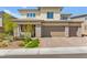 Beautiful two-story home with stone accents, three-car garage, and well-maintained landscaping at 767 Tallgrass St, Las Vegas, NV 89138