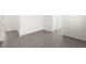 A bright hallway features wood look tile floors and views of other rooms at 767 Tallgrass St, Las Vegas, NV 89138
