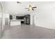 Modern kitchen with dark cabinetry, stainless steel appliances, granite counters, and an island with bar seating at 767 Tallgrass St, Las Vegas, NV 89138