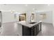 Kitchen island with sink and stainless steel dishwasher in an open floor plan home at 767 Tallgrass St, Las Vegas, NV 89138