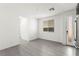 Bright and airy living room with a window and access to the kitchen area at 767 Tallgrass St, Las Vegas, NV 89138