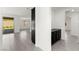 Hallway view to the living room and view of the backyard through sliding glass door at 767 Tallgrass St, Las Vegas, NV 89138