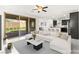 Bright living room showcases sliding glass doors, modern furniture, and an open floor plan at 767 Tallgrass St, Las Vegas, NV 89138