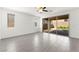 Bright, airy living room features a ceiling fan, large windows, and sliding glass doors for natural light at 767 Tallgrass St, Las Vegas, NV 89138