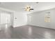 Bright living room featuring tile flooring, ceiling fan, natural light, and a clean, minimalist design at 767 Tallgrass St, Las Vegas, NV 89138