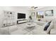 Inviting living room featuring a comfortable sofa, decorative artwork, and plenty of natural light at 767 Tallgrass St, Las Vegas, NV 89138