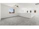 Spacious loft featuring plush carpeting, railing, and natural light at 767 Tallgrass St, Las Vegas, NV 89138