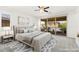Serene main bedroom features a sliding door to a private balcony and stylish decor at 767 Tallgrass St, Las Vegas, NV 89138