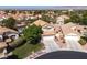 Residential neighborhood with single-Gathering homes, mature trees, and a mountain backdrop at 7837 Fort Ruby Pl, Las Vegas, NV 89128