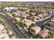 Aerial view of property, showcasing mature landscaping, tile roofs and proximity to amenities at 7837 Fort Ruby Pl, Las Vegas, NV 89128