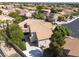 Aerial view of home showcasing tile roof, backyard, and patio with basketball court at 7837 Fort Ruby Pl, Las Vegas, NV 89128