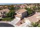 A high-angle view of a house in a neighborhood with red tiled roofs at 7837 Fort Ruby Pl, Las Vegas, NV 89128