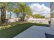 Well-maintained backyard featuring lush artificial turf and a concrete patio area, perfect for outdoor relaxation and entertainment at 7837 Fort Ruby Pl, Las Vegas, NV 89128
