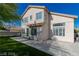 View of the house exterior from the backyard featuring a patio and artificial grass at 7837 Fort Ruby Pl, Las Vegas, NV 89128