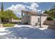 Spacious backyard featuring a concrete patio, basketball hoop, and artificial turf at 7837 Fort Ruby Pl, Las Vegas, NV 89128