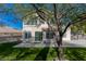 Beautiful backyard with artificial grass, patio, and mature landscaping; perfect for entertaining at 7837 Fort Ruby Pl, Las Vegas, NV 89128