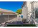 View of the side yard showing the rock features with an access gate and block wall at 7837 Fort Ruby Pl, Las Vegas, NV 89128