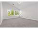 Spacious bedroom with neutral decor, large windows, and modern lighting fixtures at 7837 Fort Ruby Pl, Las Vegas, NV 89128