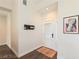 Well-lit entryway with a decorative front door, a modern wall organizer, and an elegant patterned rug at 7837 Fort Ruby Pl, Las Vegas, NV 89128