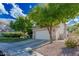 Two-story home featuring desert landscaping, a spacious driveway, and an attached two-car garage at 7837 Fort Ruby Pl, Las Vegas, NV 89128