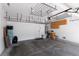 Spacious garage with ample storage, overhead racks, and a functional layout, providing convenience for parking and organization at 7837 Fort Ruby Pl, Las Vegas, NV 89128
