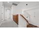 Bright hallway featuring built in cabinetry and stairs to the home's second floor at 7837 Fort Ruby Pl, Las Vegas, NV 89128
