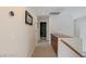 Upstairs hallway featuring carpet floors, with cabinet storage space and decorative lighting at 7837 Fort Ruby Pl, Las Vegas, NV 89128