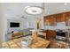 Open kitchen with stainless steel appliances and an eat-in dining area, seamlessly connected to the living room at 7837 Fort Ruby Pl, Las Vegas, NV 89128