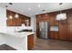 Spacious kitchen with stainless steel appliances and an island with a marble countertop at 7837 Fort Ruby Pl, Las Vegas, NV 89128