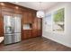 Bright eat-in kitchen featuring stainless steel appliances and hardwood floors at 7837 Fort Ruby Pl, Las Vegas, NV 89128