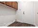 Laundry room features modern washer/dryer hookups, white walls and tile flooring at 7837 Fort Ruby Pl, Las Vegas, NV 89128