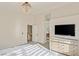 Spacious main bedroom with a vaulted ceiling, chandelier and a light wood dresser offering ample storage at 7837 Fort Ruby Pl, Las Vegas, NV 89128