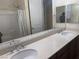Bathroom with dual sinks and a large mirror, and a shower/tub combination at 7934 Cape Flattery Ave, Las Vegas, NV 89147