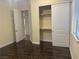 Bedroom features wood flooring, a window, and a closet with sliding doors at 7934 Cape Flattery Ave, Las Vegas, NV 89147