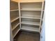 Bright closet featuring built-in shelving for optimal storage and organization at 7934 Cape Flattery Ave, Las Vegas, NV 89147