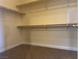 Walk-in closet with carpet flooring and adjustable shelving for optimal storage solutions at 7934 Cape Flattery Ave, Las Vegas, NV 89147