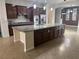 Open kitchen with granite counters, stainless steel appliances and center island at 7934 Cape Flattery Ave, Las Vegas, NV 89147