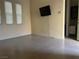 Inviting living room features tile flooring and a wall-mounted television at 7934 Cape Flattery Ave, Las Vegas, NV 89147