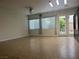 Spacious living room with tile flooring, ceiling fan, and natural light at 7934 Cape Flattery Ave, Las Vegas, NV 89147