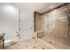 This bathroom features a frameless glass shower with a built-in seat and tiled floors at 9101 Alta Dr # 1203, Las Vegas, NV 89145