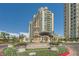Luxury high-rise residence featuring meticulously landscaped grounds and elegant fountain, offering an upscale living experience at 9101 Alta Dr # 1203, Las Vegas, NV 89145