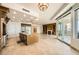Spacious kitchen with a center island, breakfast bar, fireplace, stainless steel appliances, and access to the balcony at 9101 Alta Dr # 1203, Las Vegas, NV 89145