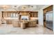 Bright eat-in kitchen with a center island, modern appliances, granite countertops, and custom cabinetry at 9101 Alta Dr # 1203, Las Vegas, NV 89145