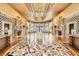 Grand lobby boasting exquisite flooring, soaring ceilings, ornate chandeliers, and elegant decor, radiating opulence at 9101 Alta Dr # 1203, Las Vegas, NV 89145